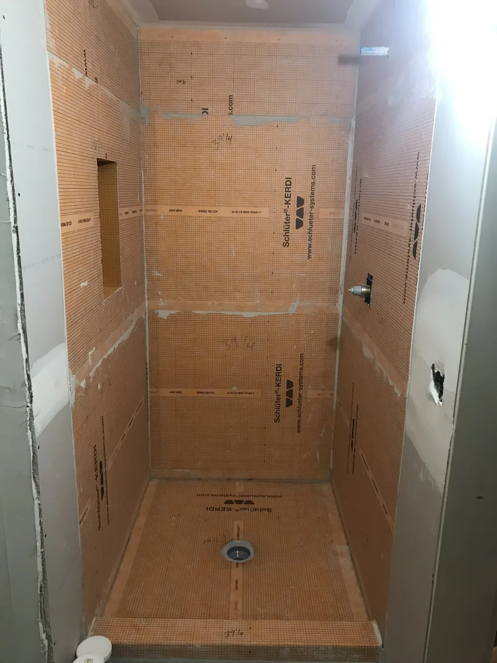 Before: marble tile shower rebuild