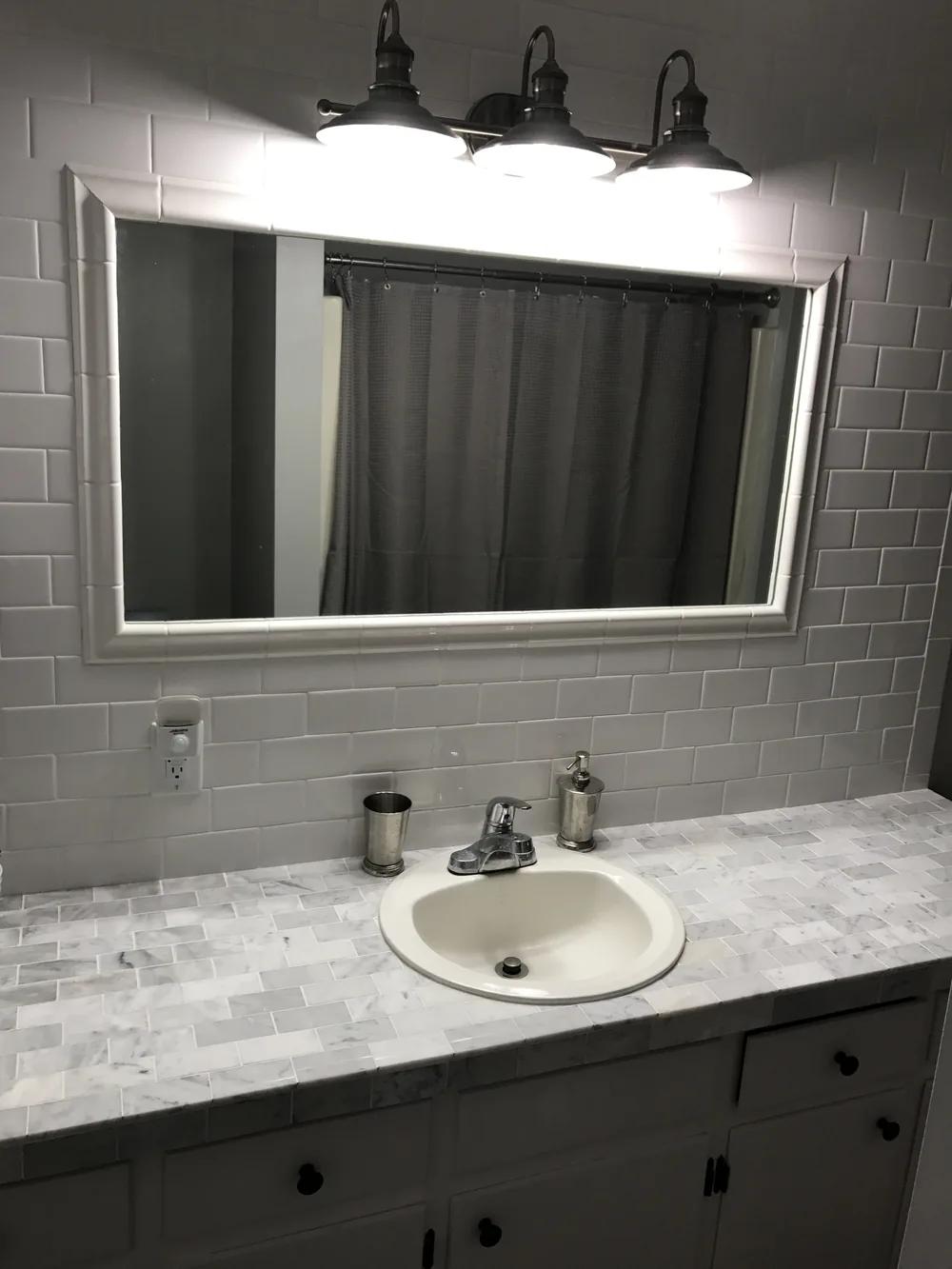 Bathroom remodel, marble-top vanity by Creative Construction Concepts