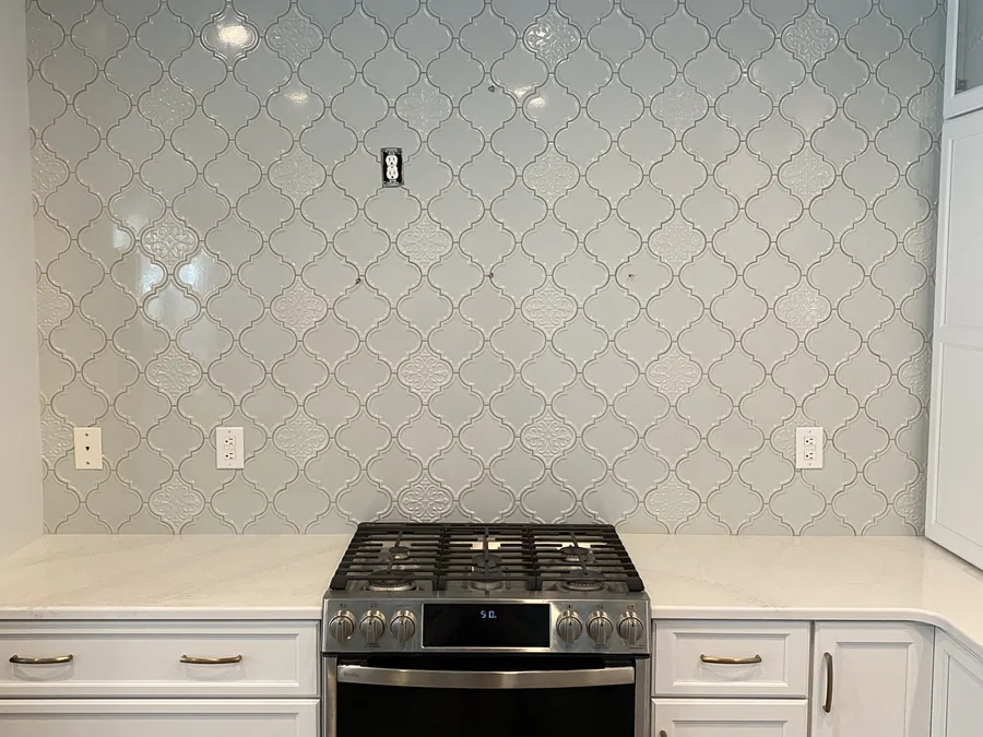 Kitchen remodel with an arabesque tile backsplash by Creative Construction Concepts