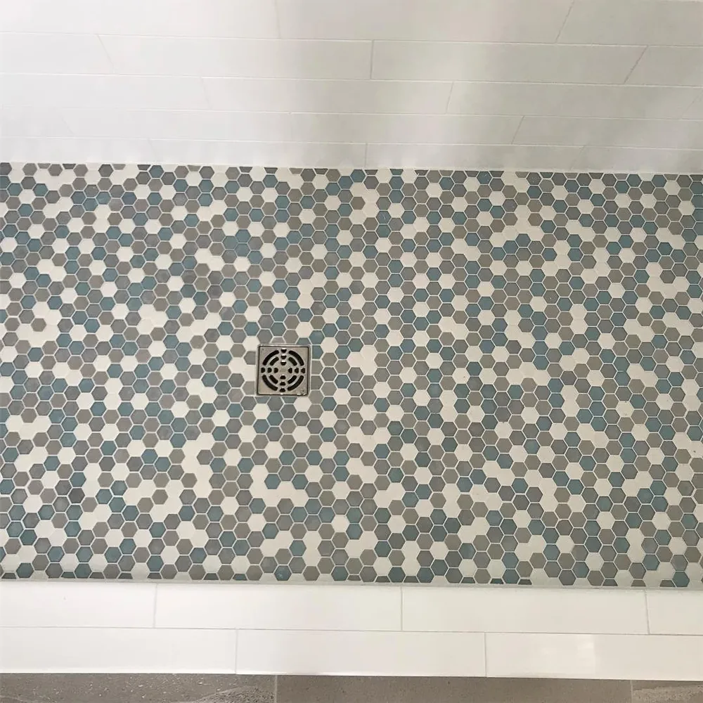 Hexagon mosaic shower floor by Creative Construction Concepts