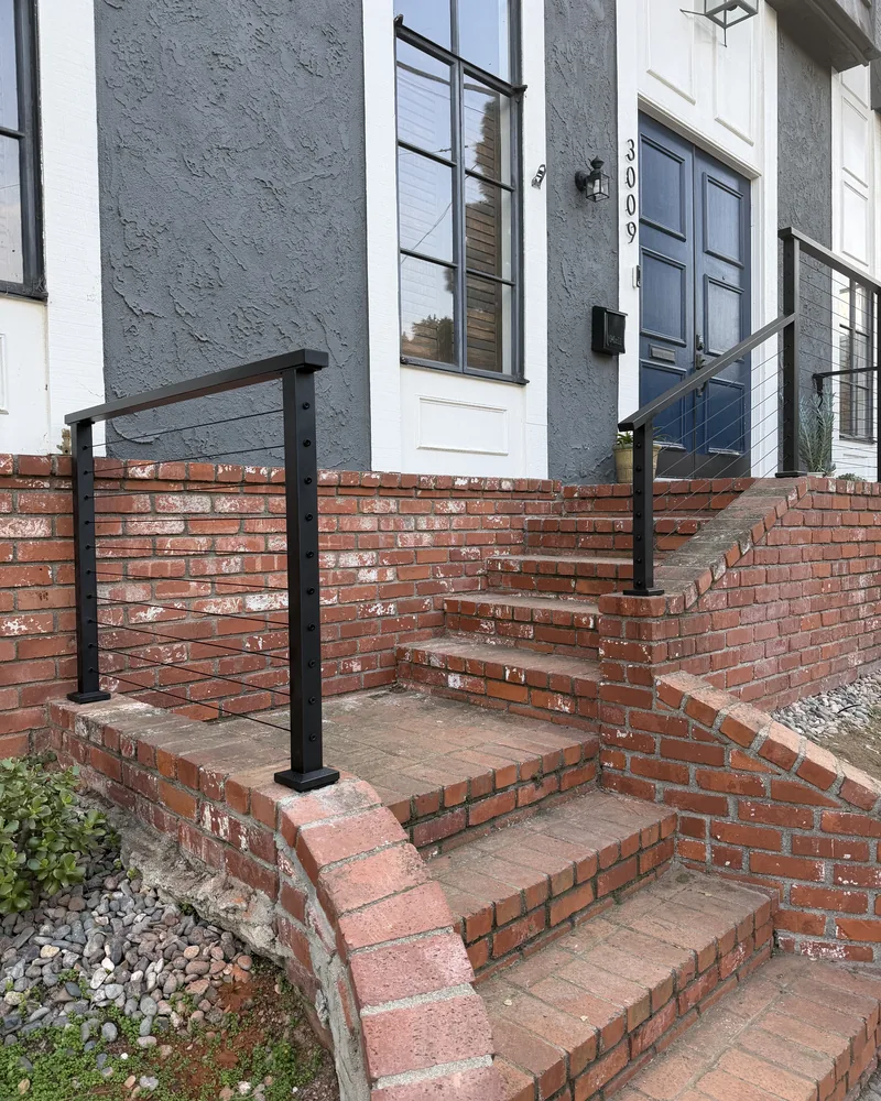 Brick entry steps and curved retaining wall, by Creative Construction Concepts in Los Angeles