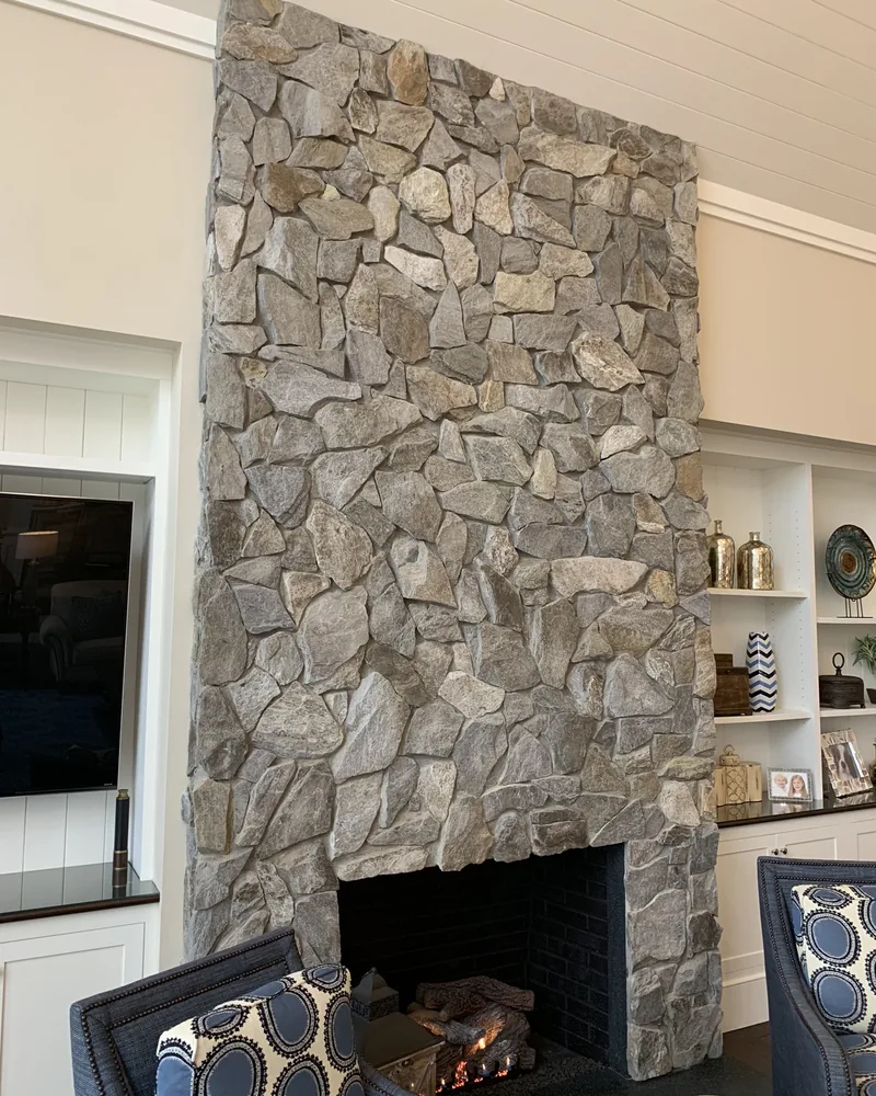 Floor to ceiling stone fireplace, ceiling to hearth, by Creative Construction Concepts in Los Angeles